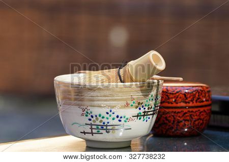 Japanese Matcha Green Tea In A Ceramic Bowl With Tea Whisk