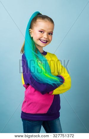 Beauty Fashion Model Kid Girl With Colorful Dyed Hair. Girl With Perfect Makeup And Hairstyle. Model