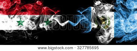 Syria Vs Guatemala, Guatemalan Smoke Flags Placed Side By Side. Thick Colored Silky Smoke Flags Of S