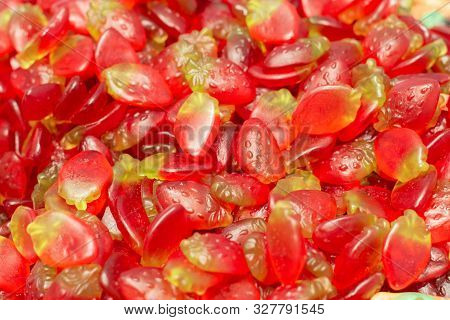 Strawberry Marmalade In The Shape Of Ripe Red Berries, Jelly Sweets Background Close-up. Sweets At T