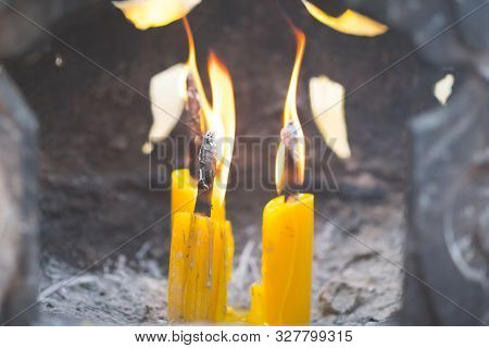 Asian Thai People And Foreigner Burning Candle At Joss Stick Pot Or Thurible For Respect And Pray Go