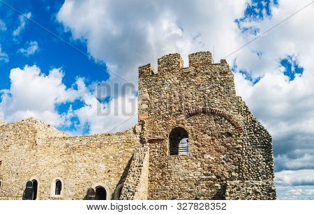 Tower Of The Neamt Citadel Under The Cloudy Blue Sky. It Is A Medieval Fortress Located In North-eas