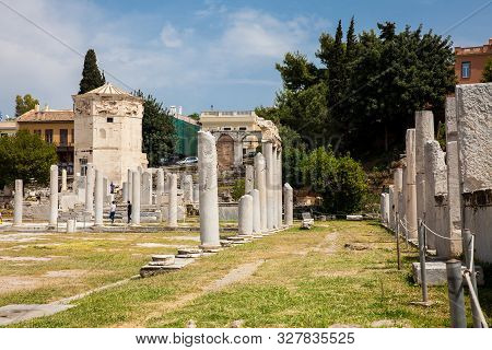 Athens, Greece - April, 2018: Tourists Visiting The Ancient Ruins At The Roman Agora Located To The