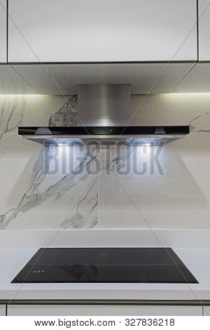 Interior Design Decor Showing Modern Kitchen Cooker Hob Appliance With Extractor Fan In Luxury Apart