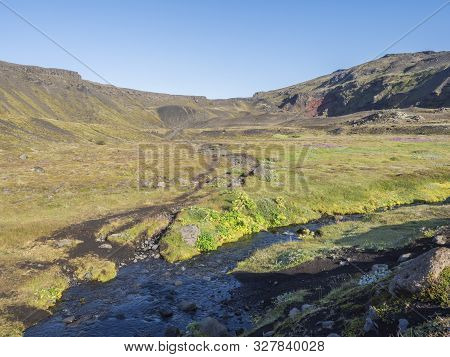 Icelandic Landscape With Blue River Stream And Lush Green Vegatation At Iceland On Laugavegur Hiking