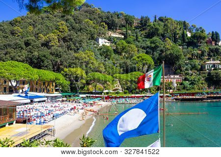 The Sand Beach Known As Paraggi Near Portofino In Genoa On A Blue Sky And Sea Background