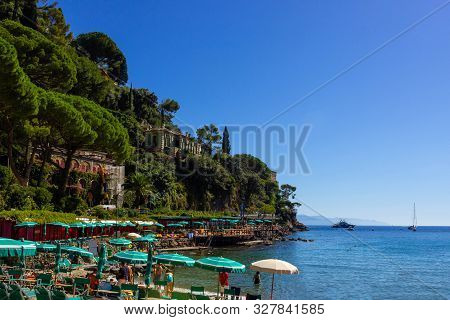 The Sand Beach Known As Paraggi Near Portofino In Genoa On A Blue Sky And Sea Background