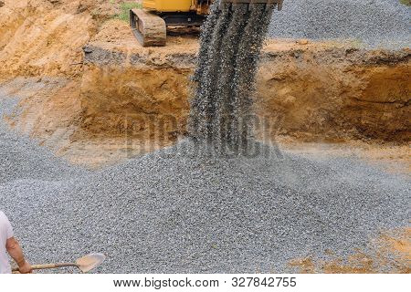 A Excavator In A Working To Gravel Construction Equipment For Foundation Construction Of Residential