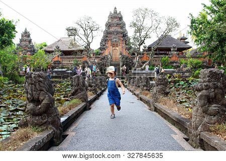 Ubud, Bali, Indonesia - August 6th Of 2019: Cute Little Kid Having Fun In Pura Taman Saraswati 