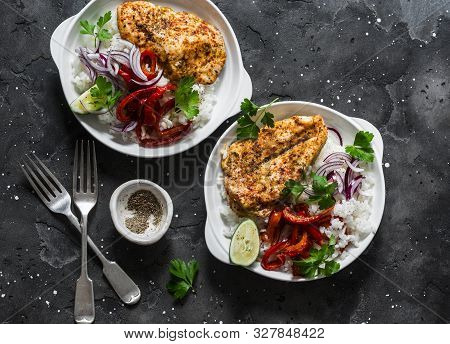 Baked Spicy Chicken Breast With Sweet Pepper And Rice -  Delicious Mexican Style Lunch On A Dark Bac