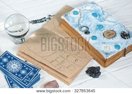 Tarot Cards, Crystal Ball, Palmistry Book On A Magic Table Background. Future Reading. Science Of Di