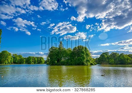 The Englischer Garten In Munich, Bavaria, Germany On A Sunny Day.