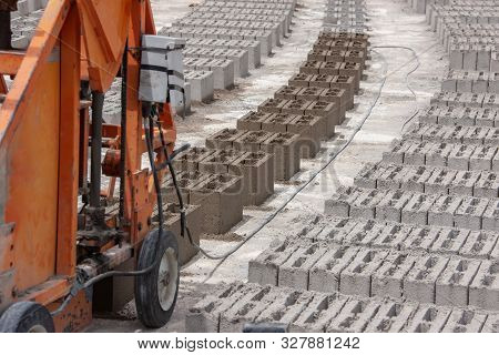 Bricks And A Brick Machine On A Construction Site In Botswana, Africa