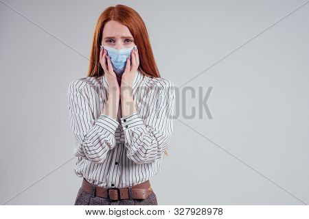 Unhappy Redhead Woman Green Eyes Businesswomen In A Striped Shirt Wearing Gauze Blue Mask White Back
