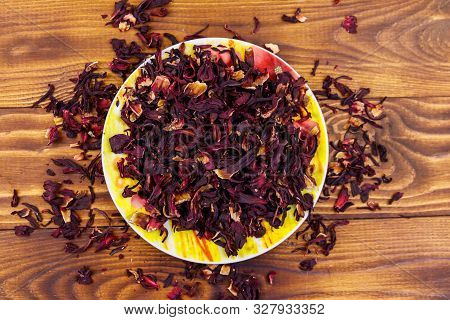 Dried Hibiscus (carcade, Roselle) On Wooden Table