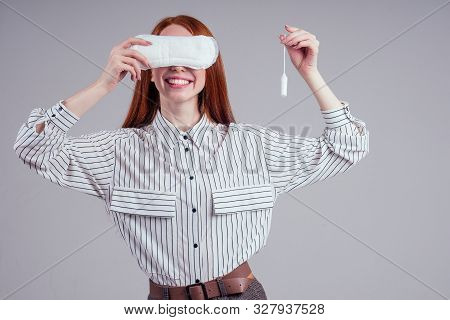 Closeup Photo Of Young Redhead Businesswoman In Striped Shirt Holding Hygiene Pad Choosing Tampon St