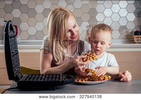 Caucasian Family Together Cooking Kitchen.boy And Mother Eating Belgian Waffles Waffle Iron