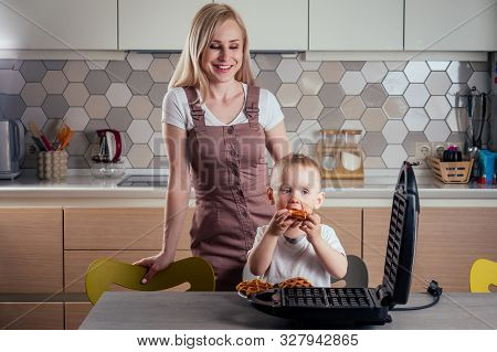 Caucasian Family Together Cooking Kitchen.boy And Mother Eating Belgian Waffles Waffle Iron