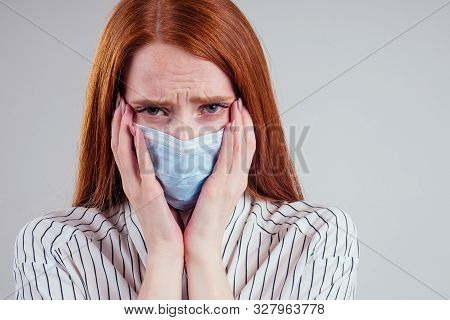 Unhappy Redhead Woman Green Eyes Businesswomen In A Striped Shirt Wearing Gauze Blue Mask White Back
