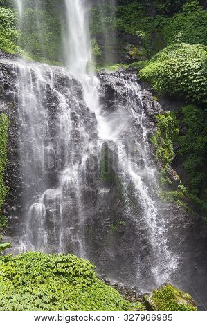 Sekumpul Waterfalls In Bali, Indonesia.waterfall In Green Forest. Triple Tropical Waterfall Sekumpul
