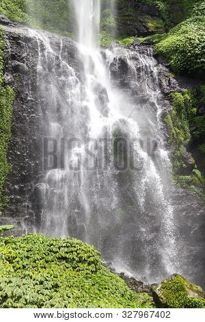Sekumpul Waterfalls In Bali, Indonesia.waterfall In Green Forest. Triple Tropical Waterfall Sekumpul