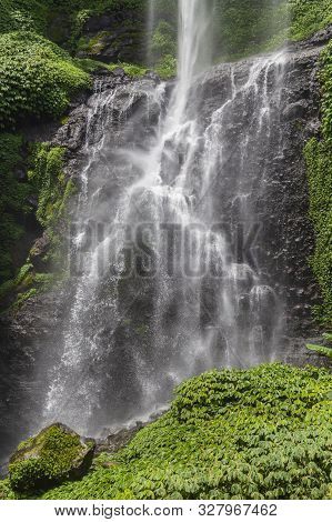 Sekumpul Waterfalls In Bali, Indonesia.waterfall In Green Forest. Triple Tropical Waterfall Sekumpul