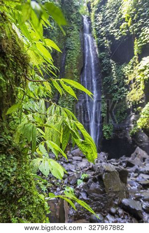 Sekumpul Waterfalls In Bali, Indonesia.waterfall In Green Forest. Triple Tropical Waterfall Sekumpul
