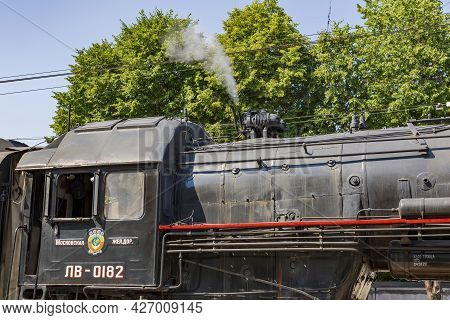 Black Retro Steam Locomotive At The Railway Station On A Sunny Day