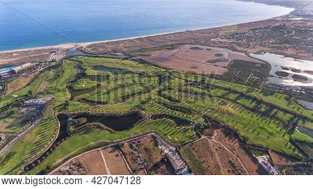 Green Golf Courses By The Sea. Salgados Beach. Portugal, Albufeira. Aerial View.