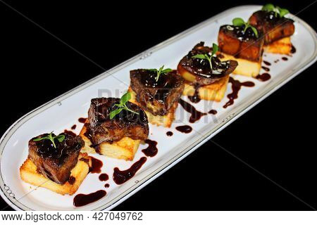 Pan Fried French Goose Or Duck Foie Gras On Toasted Brioche Bread And Amarena Cherry