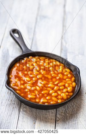 Baked beans, classic american staple food served in a skillet