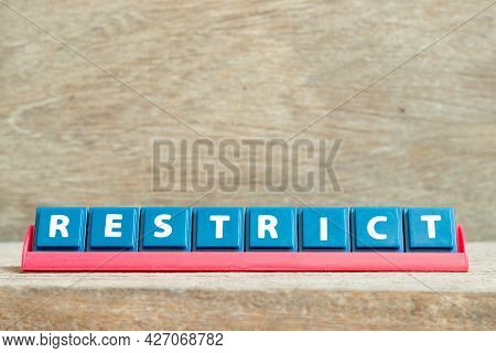 Tile Alphabet Letter With Word Restict In Red Color Rack On Wood Background