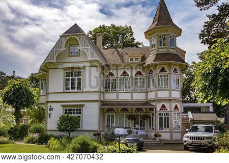 Latvia, Jurmala, July, 2021 - Exterior View Renovation Wooden Home In Jurmala, Latvia. Traditional J