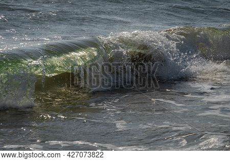 Colored Sea Waves With Splashes And White Breakers In Circeo Park, Sabaudia, Italy