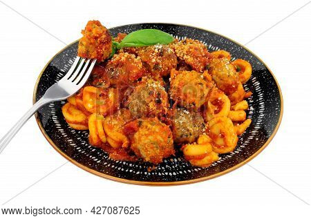 Beef And Pork Meatballs Al Forno With Trulli Pasta In Tomato Sauce Meal Isolated On A White Backgrou