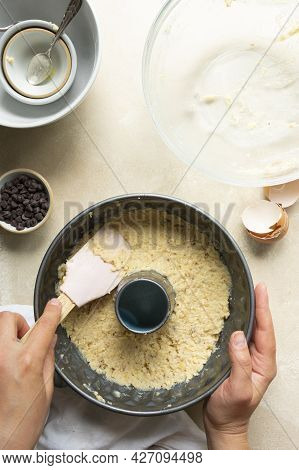 Female Hands Cooking Bundt Cake In Bundt Tin Metal Pan, Raw Cake Dough
