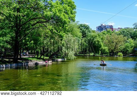 Bucharest, Romania - 9 May 2021: Vivid Green Landscape With Old Large Linden Trees And Green Leaves 