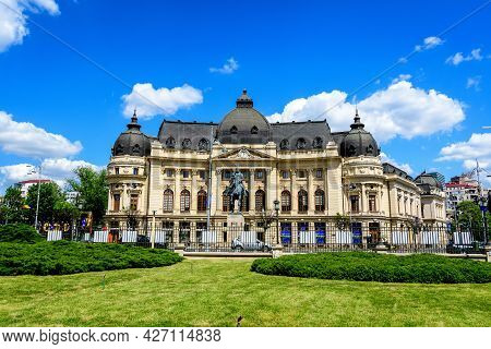 Bucharest, Romania, 6 May 2021: The Central University Library With Equestrian Monument To King Caro
