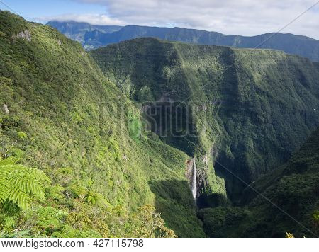 Scenic Viewpoint On The Trou De Fer With Light And Shadow Effects On The Impressive Steep Mountains 