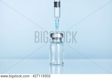 Close-up Of Syringe And Injection Vial Efficient For Flu, Coronavirus, Covid-19 Vaccine Disease