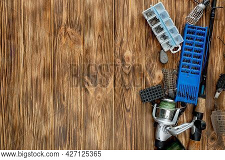 Flat Lay With Fishing Tackle, Fishing Rod And Plastic Box With Fishing Tackle And Hooks, Feeders On
