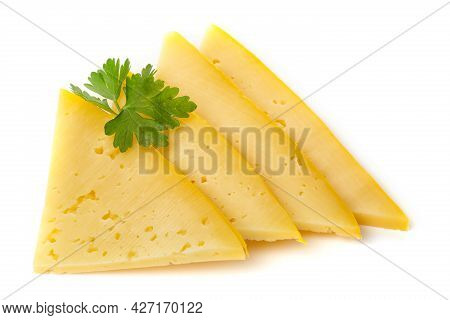 Pieces Of Semi-hard Or Hard Yellow Cheese With Holes And Parsley Leaf Isolated On A White Background
