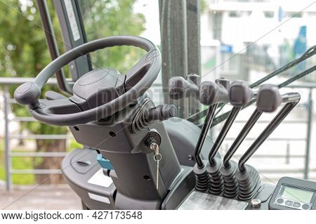 Forklift Truck Steering Wheel And Levers Commands In Cabin
