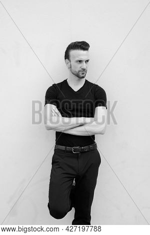 Black And White Portrait Of Handsome Italian Man With Arms Crossed Thinking