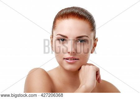 Portrait Of Pretty Redheaded Woman With Fresh Sking And Natural Professional Makeup Isolated On Whit