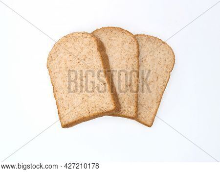 Three Fresh Whole Wheet Slices Isolated On White Background, Bread