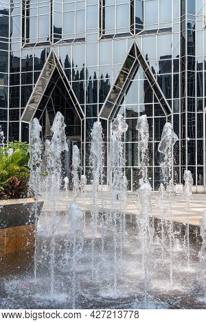 Frozen Water From Fountain In Front Of Reflective Office Building In Downtown Pittsburgh