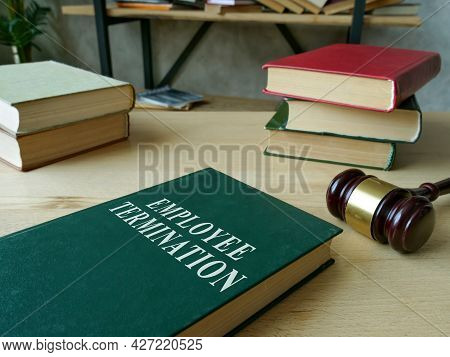 Employee Termination Rules Book And Wooden Gavel.