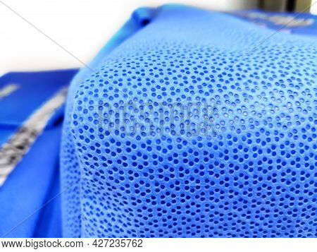Surgical Instrument Set Wrapped With Blue Disposable Drape Sheet. Selective Focus