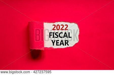 2022 Fiscal New Year Symbol. Words '2022 Fiscal Year' Appearing Behind Torn Purple Paper. Beautiful 